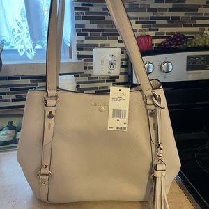 Brand new Michael Kors purse with tags.